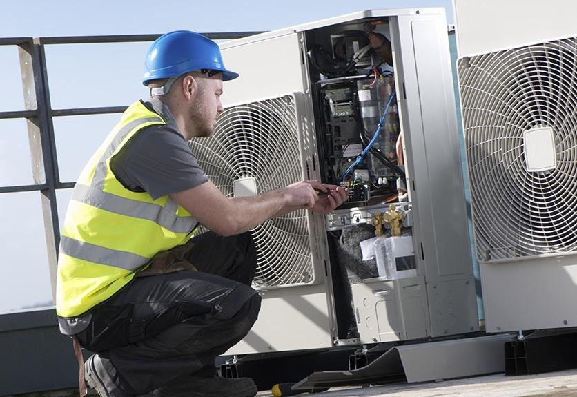 Maintenance engineer servicing equipment under contract