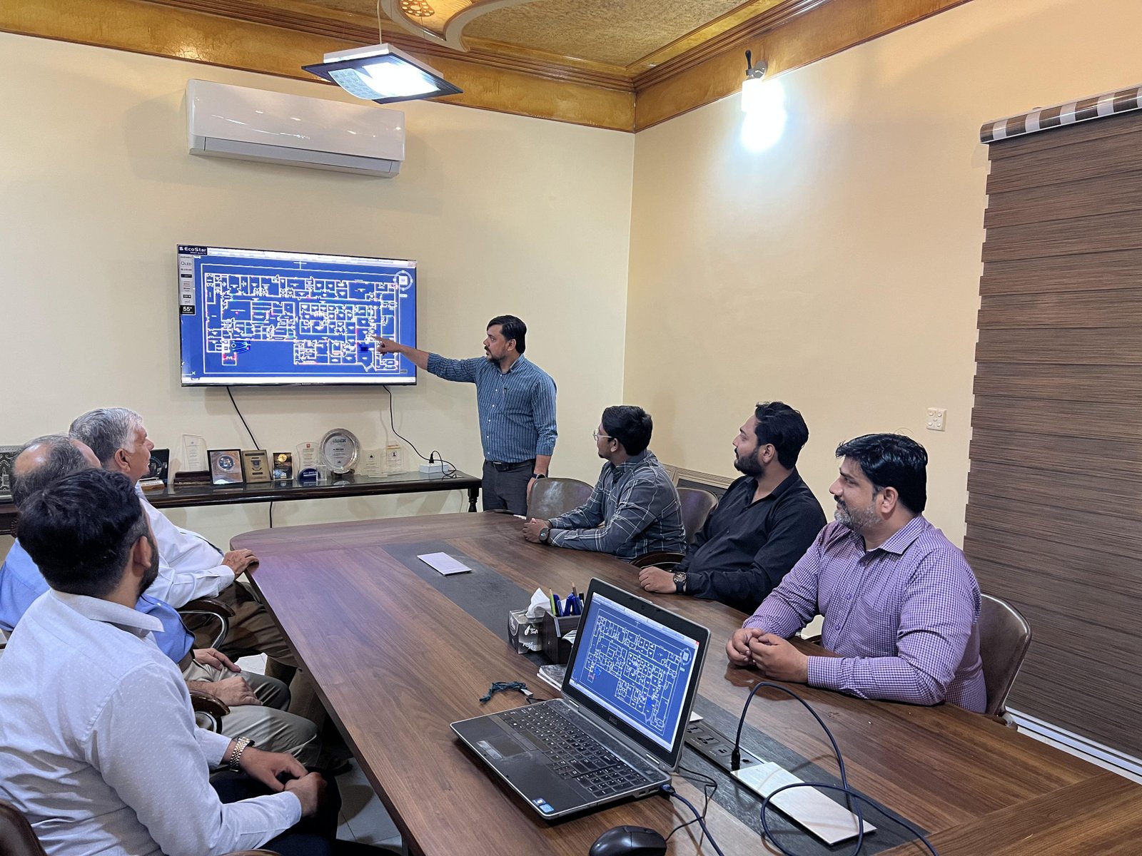 HVAC consulting session reviewing engineering plans